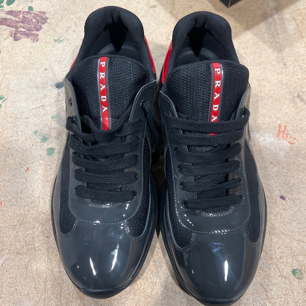 Grey & red low top Prada sneakers